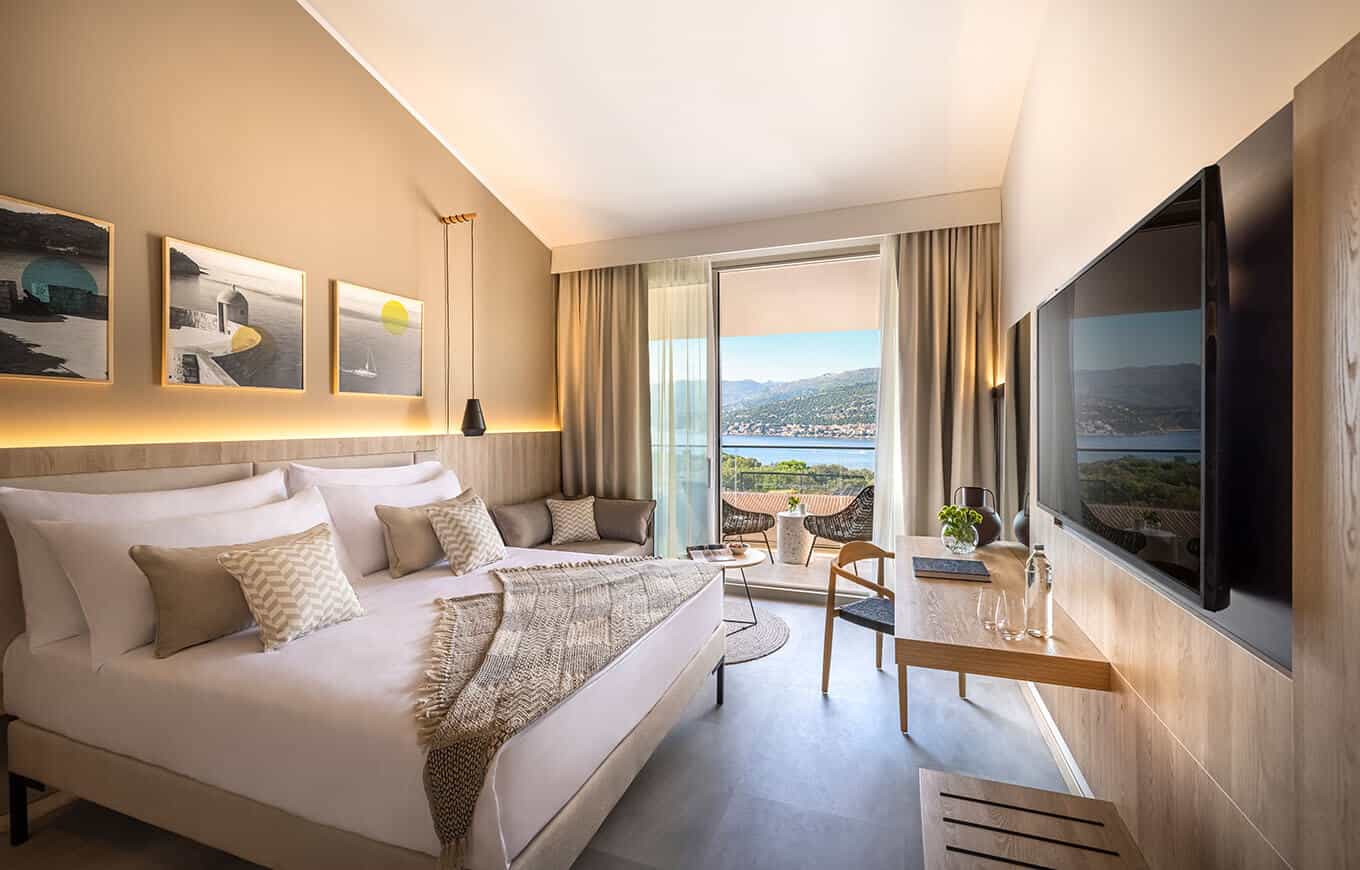 Hotel room with balcony view of the sea and mountains at Valamar Tirena hotel Dubrovnik