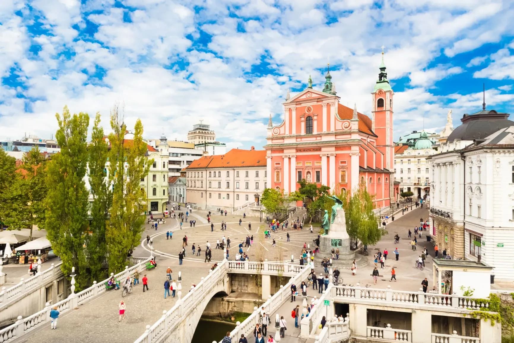 Pink Franciscan Church overlooking Prešeren Square and Triple Bridge in Ljubljana, Slovenia.
