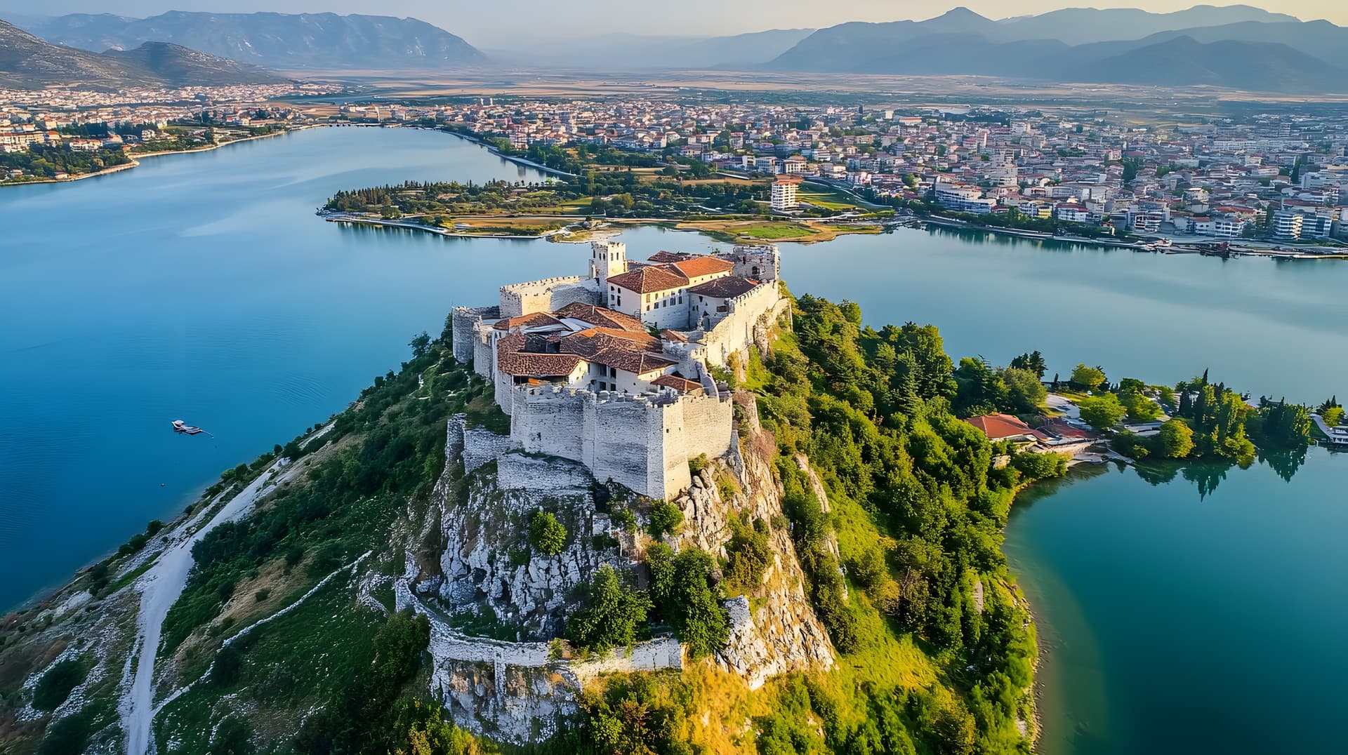 Rozafa Castle overlooking Shkodra city, lake, and mountains in Albania.