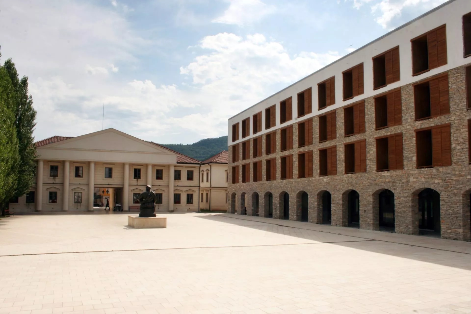 Andrićgrad ethno-village square with neoclassical and stone buildings in Višegrad, Bosnia and Herzegovina.