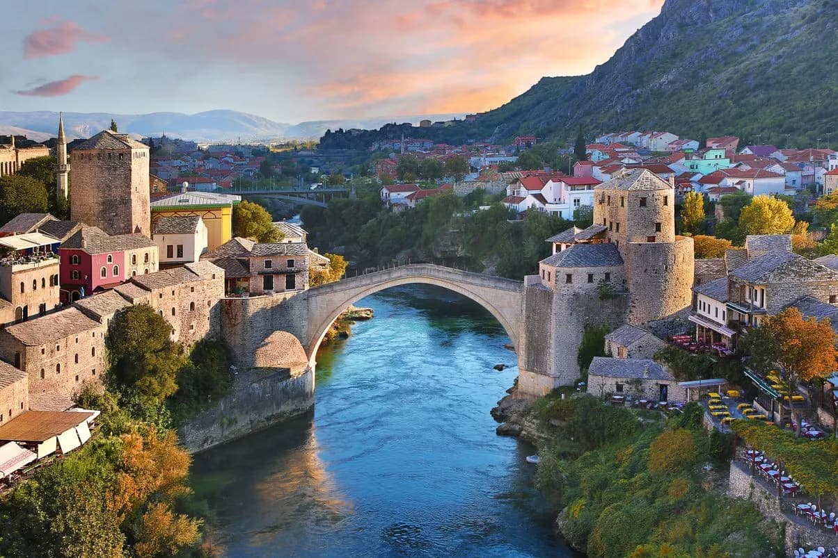 Stari Most bridge over the Neretva River in Mostar, Bosnia and Herzegovina at sunset.