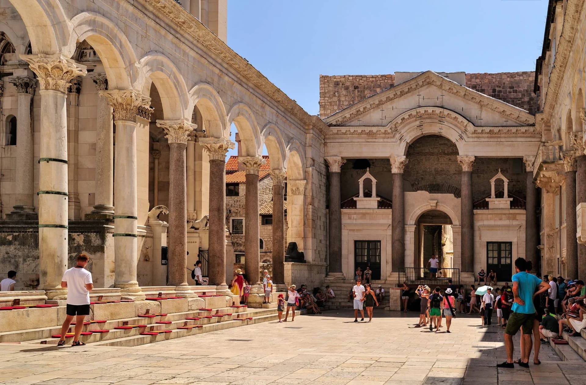 Tourists in the peristyle courtyard of Diocletian's Palace in Split, Croatia.